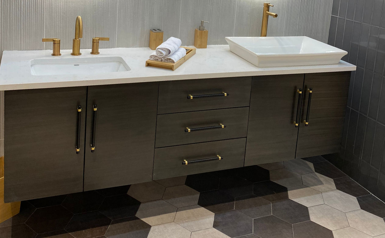 Black floating bathrooom vanity with two sinks, mirrors, and stylish blue cabinetry 