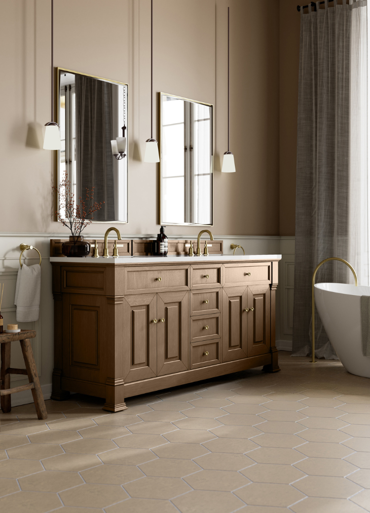 bathrooom vanity with two sinks, mirrors, and stylish blue cabinetry